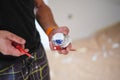 Closeup shot of hands of an electrician installing a light switch Royalty Free Stock Photo