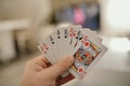 Closeup shot of hands holding playing cards Royalty Free Stock Photo