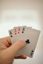 Closeup shot of hands holding playing cards Royalty Free Stock Photo