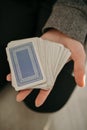 Closeup shot of hands holding playing cards Royalty Free Stock Photo