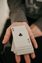 Closeup shot of hands holding playing cards Royalty Free Stock Photo