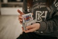 Closeup shot of hands holding playing cards Royalty Free Stock Photo