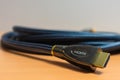 Closeup shot of an HDMI cable on a wooden surface