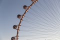 Closeup shot of the High Roller observation wheel in Las Vegas with an airplanein a clear sky Royalty Free Stock Photo