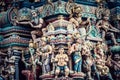 Closeup shot of Hindu ornaments and a group of Deity statues of a Hindu temple in Singapore Royalty Free Stock Photo