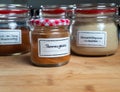 Closeup shot of a french fries spices jar on the table with two other jars in the blurred background Royalty Free Stock Photo