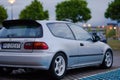 Closeup shot of the Honda Civic EG LSi with Spoon spoiler parked outdoors