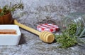 Closeup shot of honey and herbs from the woody stems of rosemary Royalty Free Stock Photo