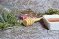 Closeup shot of honey and herbs from the woody stems of rosemary Royalty Free Stock Photo