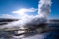 Closeup shot of a hot geysir spring coming out of the earth on a cold winter day