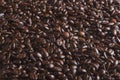Closeup shot of a huge pile of dark coffee beans
