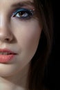 Closeup shot of human woman face. Female with face and eyes beauty makeup with blue eye shadow make up and rhinestones Royalty Free Stock Photo