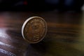 Closeup shot of an India Rupees coin on a wooden table