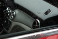 Closeup shot of the interior of Mercedes GLA 200 on a rainy day