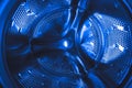 Closeup shot of the interior of a modern dark blue washing machine