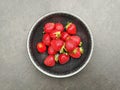 Closeup shot of juicy strawberries in a circular bowl Royalty Free Stock Photo