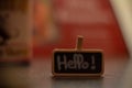 Closeup shot of a label with hello inscription on it with blurred background