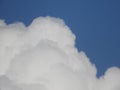 Closeup shot of large fluffy white clouds on a blue sky background