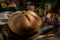 Closeup shot of a large loaf of delicious homemade bread on a kitchen table Royalty Free Stock Photo