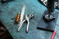 Closeup shot of leather tools on a craftsman table