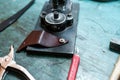 Closeup shot of leather tools on a craftsman table