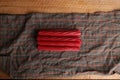 Closeup shot of licorice candy pieces on a napkin on a wooden surface Royalty Free Stock Photo