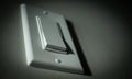 Closeup shot of a light switch against a wall Royalty Free Stock Photo