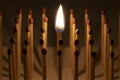 Closeup shot a lighted matchstick among other matchsticks - individuality and uniqueness concept Royalty Free Stock Photo