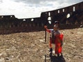 Closeup shot of a little medieval soldier toy set in the Coliseum in Rome, Italy Royalty Free Stock Photo