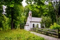 Closeup shot of a little white church in the woods Royalty Free Stock Photo