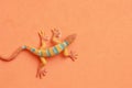 Closeup shot of lizard shaped rubber toy in color background Royalty Free Stock Photo