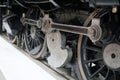 Closeup shot of locomotive gears and wheels on train tracks Royalty Free Stock Photo