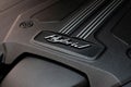 Closeup shot of a logo of a modern Bentley Bentayga 2022 Hybrid badge