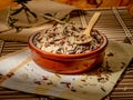 Closeup shot of long grain wild rice mix in a plate with a wooden spoon of a piece of table cover Royalty Free Stock Photo