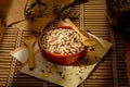 Closeup shot of long grain wild rice in a plate with wooden spoons on a piece table cover Royalty Free Stock Photo