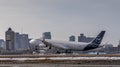 Closeup shot of a Lufthansa plane landing on the ground Royalty Free Stock Photo