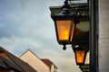 Closeup shot of a luminated vintage street light against a blurred background Royalty Free Stock Photo