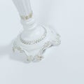 Closeup shot of a luxurious candlestick on a white background