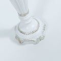 Closeup shot of a luxurious candlestick on a white background