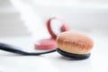 Closeup shot of a makeup brush neat a cosmetic compact mirror Royalty Free Stock Photo