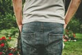 Closeup shot of a male backside standing in the garden