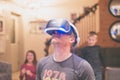 Closeup shot of a male enjoying the unbelievable feelings while wearing virtual reality glasses