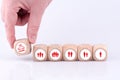 Closeup shot of a male hand putting a car sharing dice among other people icons