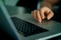 Closeup shot of male hand on touchpad of laptop Royalty Free Stock Photo