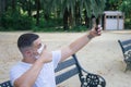 Closeup shot of a male taking a selfie wearing a sanitary mask - concept of the new normal