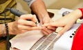 Closeup shot man making manicure to woman in beauty salon