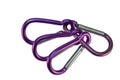 A closeup shot of many colorful carabiners isolated