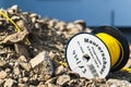 Closeup shot of masonry cord written on the yellow thread roll on the stones