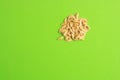 Closeup shot of melon seeds isolated on green background Royalty Free Stock Photo