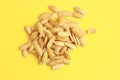 Closeup shot of melon seeds on yellow background Royalty Free Stock Photo